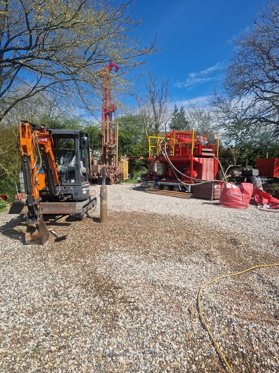 Thermal Earth drilling and support equipment set up on a ground-source project