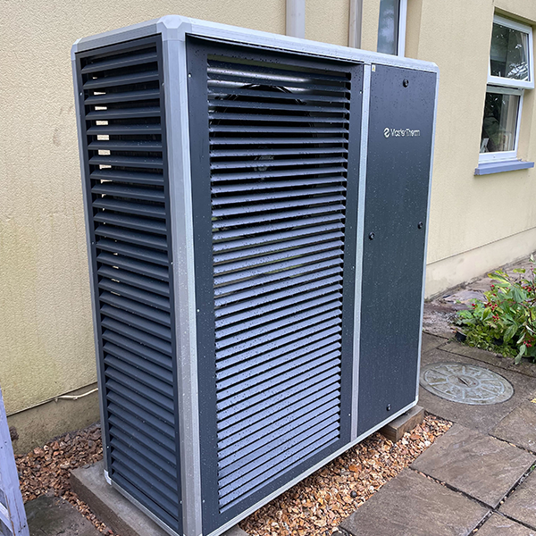 MasterTherm BoxAir air-source heat pump installed beside a home